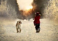 Beautiful Shot of a Small Child Walking Her Dog in Winter Canada